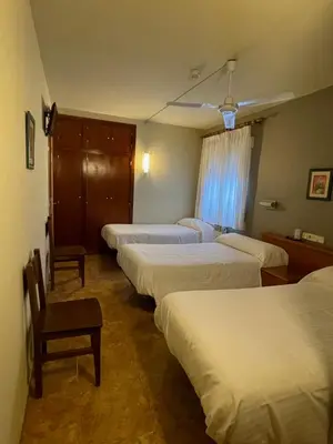 Cama o camas de una habitación en Hostal El Corzo