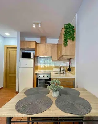 Una cocina o zona de cocina en Piso Pineta