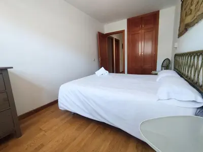 Cama o camas de una habitación en CHECK-IN CASAS Ibon