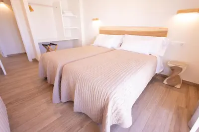 Cama o camas de una habitación en El sueño del Búho 4. Ático con chimenea y terraza.