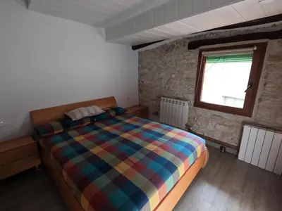 Cama o camas de una habitación en CA L'ENGRÀCIA