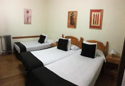 Cama o camas de una habitación en Pensión Leyre