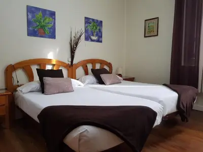 Cama o camas de una habitación en Pensión Leyre