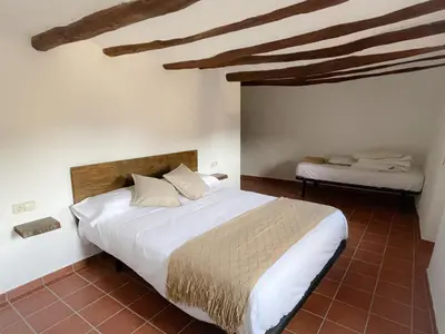 Cama o camas de una habitación en Casa Rural Cal Vellet del Priorat