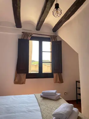 Cama o camas de una habitación en Casa Rural Cal Vellet del Priorat