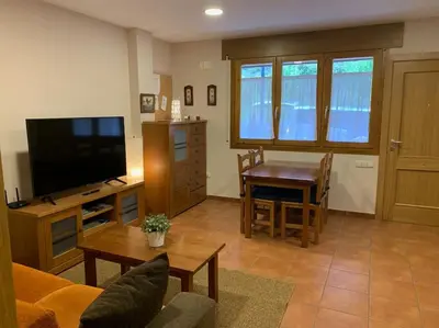 Una televisión o centro de entretenimiento en Apartamento Pineta