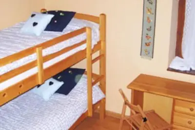 Cama o camas de una habitación en Adosado de tres plantas en el Valle de Aran