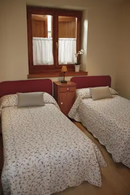 Cama o camas de una habitación en Apartamentos Valle de Aran