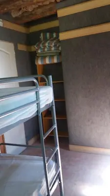 Cama o camas de una habitación en Albergue Casa Fumenal