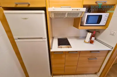 Una cocina o zona de cocina en Dos Torres Pilar Suites- balcones con vistas a la ciudad