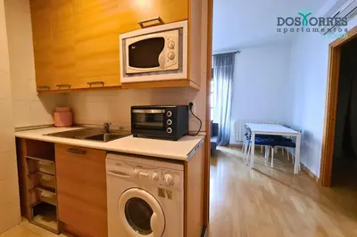 Una cocina o zona de cocina en Dos Torres Pilar Suites- balcones con vistas a la ciudad
