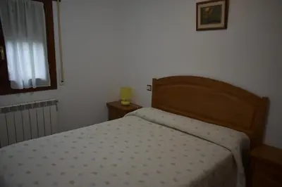 Cama o camas de una habitación en Apartamentos Casa Esperanza - Ordesa