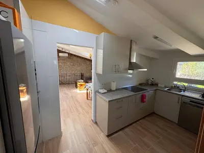 Una cocina o zona de cocina en Casa de La Serra