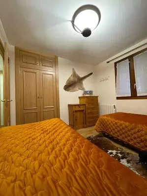Cama o camas de una habitación en Coqueto y céntrico en Panticosa