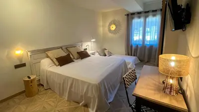 Cama o camas de una habitación en La Posada de Ruba