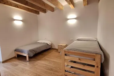 Cama o camas de una habitación en Cal Vallverdú 1I