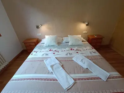 Cama o camas de una habitación en InmoCyma Montañas mágicas-Benasque