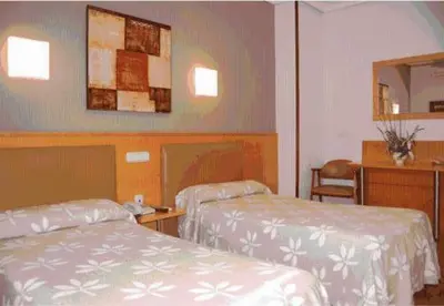 Cama o camas de una habitación en Hostal Arotza