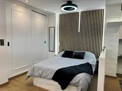 Cama o camas de una habitación en El pilar a 3 minutos