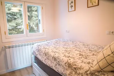 Cama o camas de una habitación en Apartamento en Formigal luminoso con balcón y vistas
