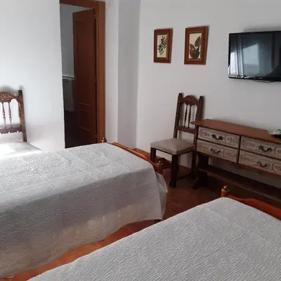 Cama o camas de una habitación en Habitaciones Peña Dorada