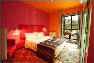 Cama o camas de una habitación en Hotel Ibaiondo
