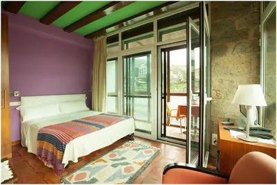 Cama o camas de una habitación en Hotel Ibaiondo