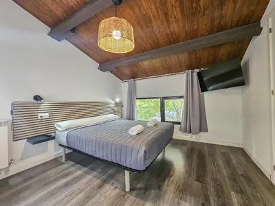 Cama o camas de una habitación en SOLOPUENT Hotel Rural