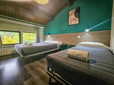 Cama o camas de una habitación en SOLOPUENT Hotel Rural