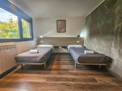 Cama o camas de una habitación en SOLOPUENT Hotel Rural