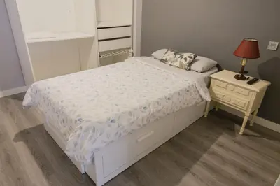 Cama o camas de una habitación en Apartamento cerca del Pilar