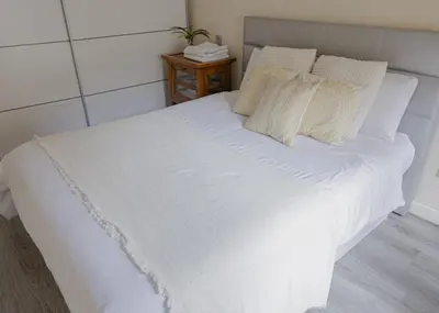 Cama o camas de una habitación en Apartamento cerca del Pilar