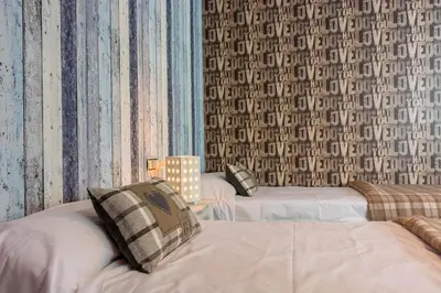 Cama o camas de una habitación en Apartamento a 15 minutos de Baqueira con parking y terraza