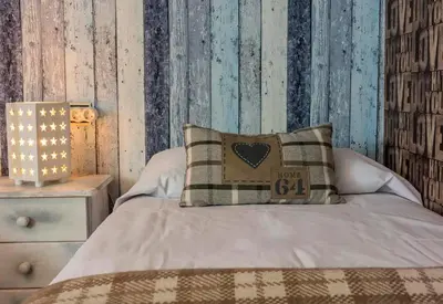 Cama o camas de una habitación en Apartamento a 15 minutos de Baqueira con parking y terraza