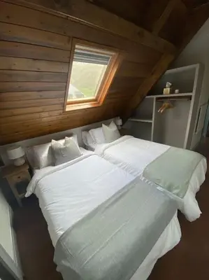 Cama o camas de una habitación en DUPLEX con encanto en Bagergue y guarda esquíes