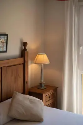 Cama o camas de una habitación en El Mirador by Cardi Suites