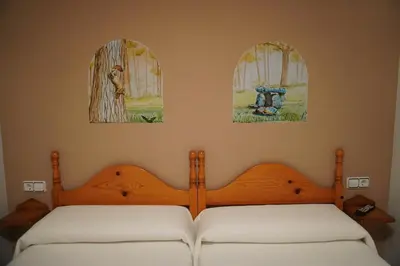 Cama o camas de una habitación en Apartamentos Casa DOMENC