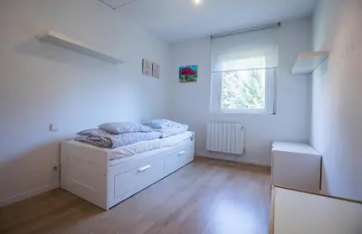 Cama o camas de una habitación en Baqueira 1500 a pie de pistas