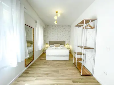 Cama o camas de una habitación en Apartamentos Zaragoza Gran Vía 3000