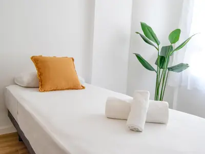 Cama o camas de una habitación en Apartamentos Zaragoza Gran Vía 3000