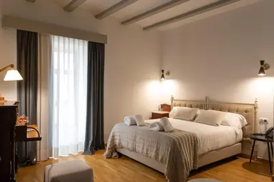Cama o camas de una habitación en Hotel Palacio Barón de Andilla