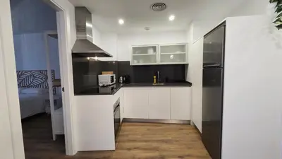 Una cocina o zona de cocina en Apartamentos Almada - calle Alfonso - Plaza SAS