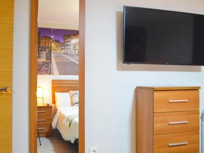Una televisión o centro de entretenimiento en Apartamento Doz
