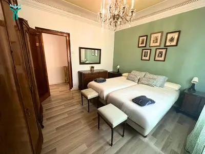 Cama o camas de una habitación en Dos Torres Lacarra- Confort y Estilo en el Centro de Zaragoza