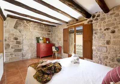 Cama o camas de una habitación en Patio con barbacoa: disfruta del Matarraña