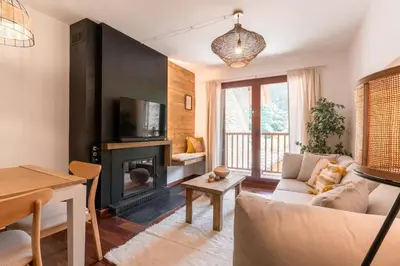 Una televisión o centro de entretenimiento en Apartament la Xisqueta - Vall Fosca - L'Amfitriona