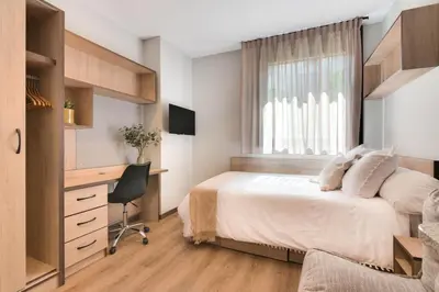 Cama o camas de una habitación en Livensa Living Pamplona Albergue Juvenil