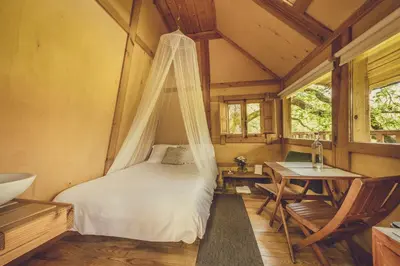Cama o camas de una habitación en Okolin Basoa Suites