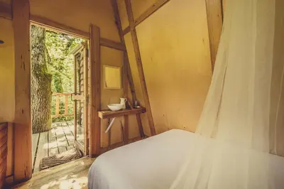 Cama o camas de una habitación en Okolin Basoa Suites