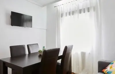Una televisión o centro de entretenimiento en Apartamento Pamplona